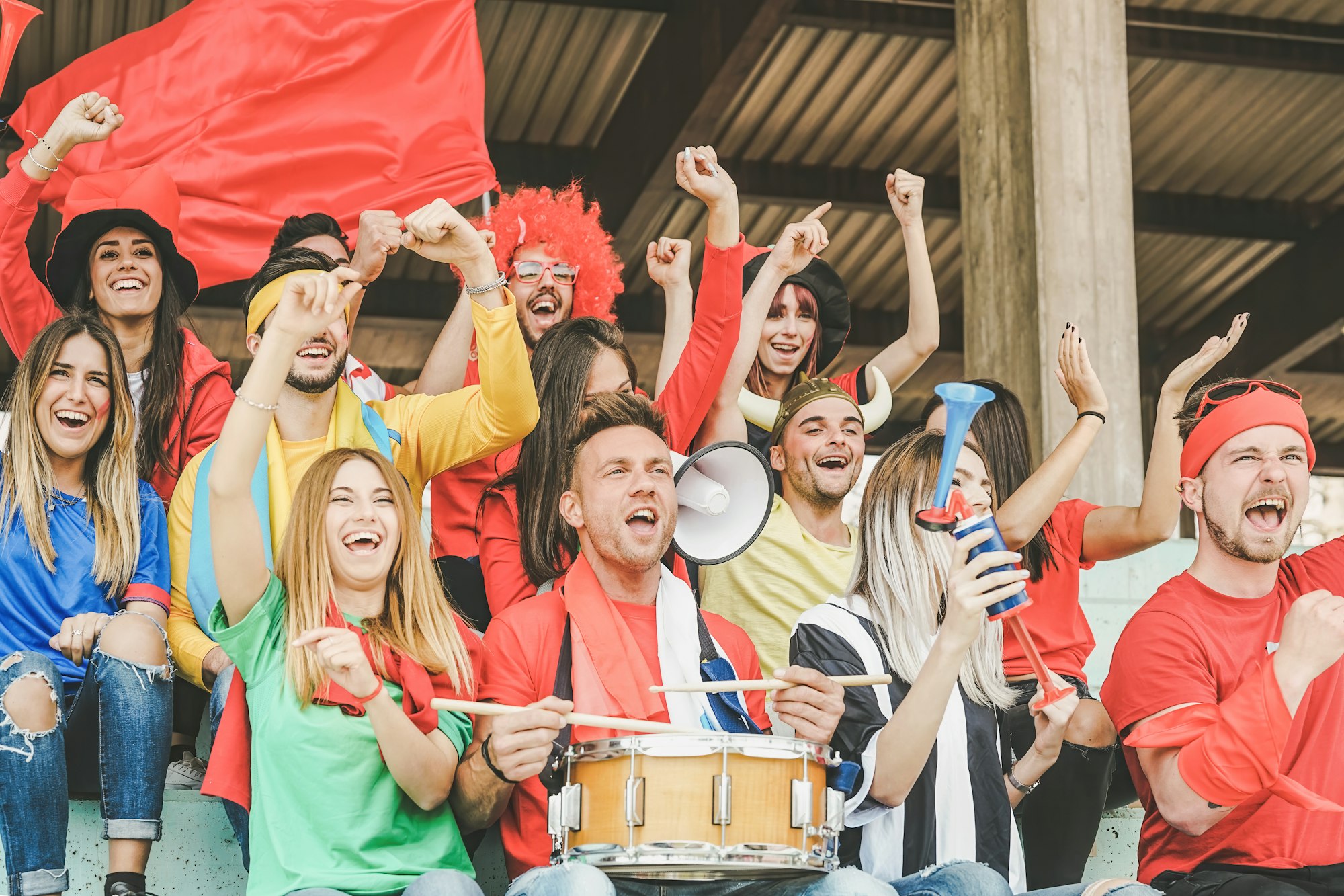 Friends football supporter fans watching soccer match event at stadium